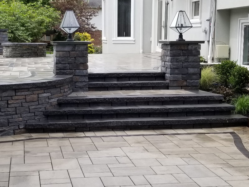 raised patio with steps and pillars
